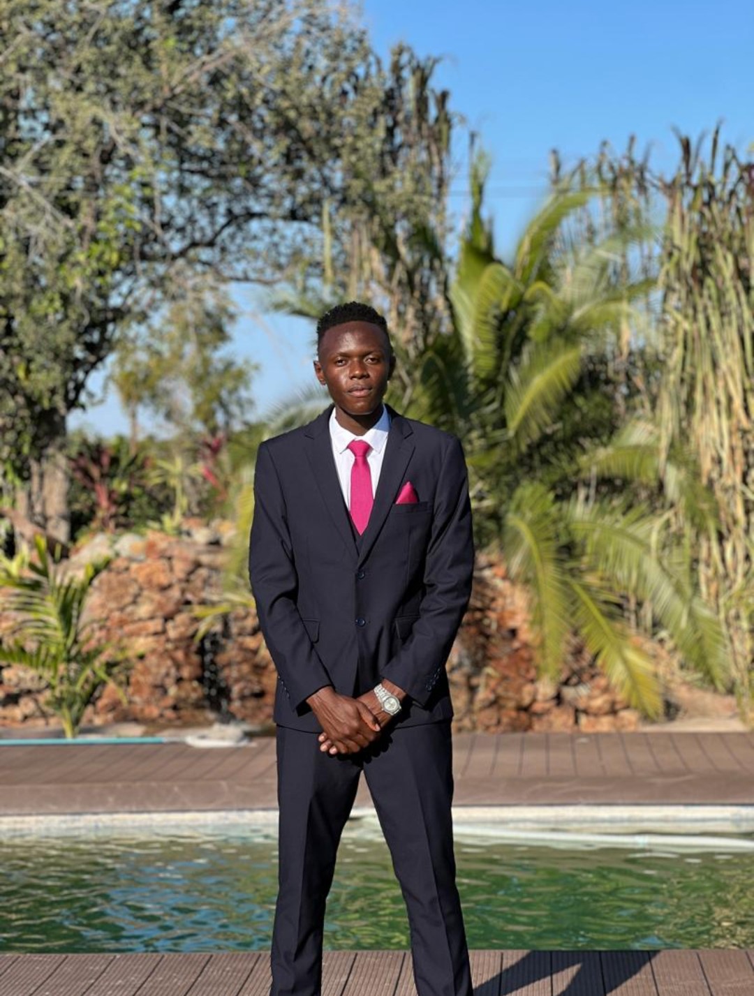Group of diverse NUST students smiling while enjoying meals at a canopy outdoor area on campus, with blue Flibuy banners and eco-friendly packaging for sustainable university dining